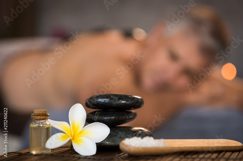 Male spa setting with black hot stones