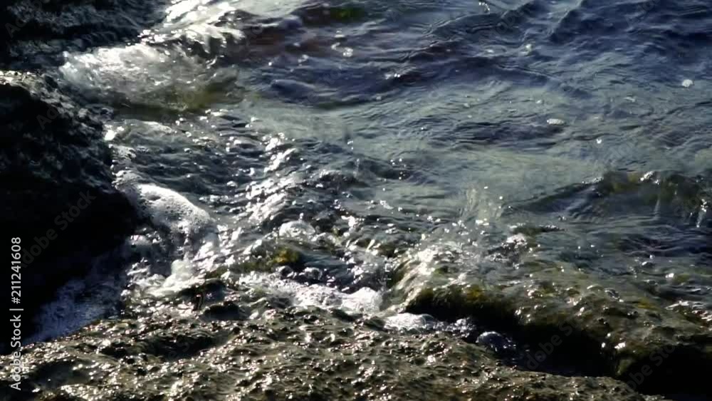 Sunset on the rocks. Silhouettes of sea waves. Caspian sea. Slow Motoin. Sunset on the rocks. Silhouettes of sea waves. Caspian sea. Slow Motoin.