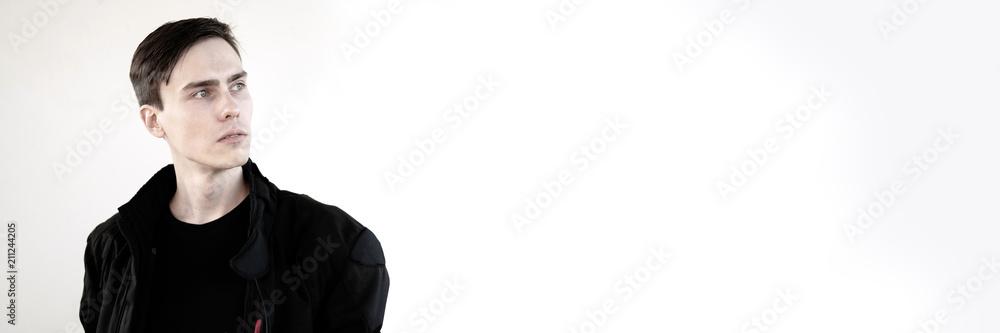 A portrait of a handsome white young man. A portrait of a handsome white young man.