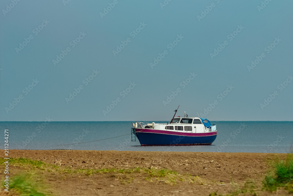 Small blue passenger ship