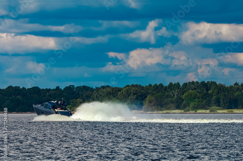 Grey motor yacht in move