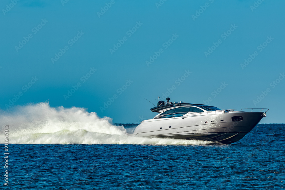 Fototapeta premium Grey motor yacht in move