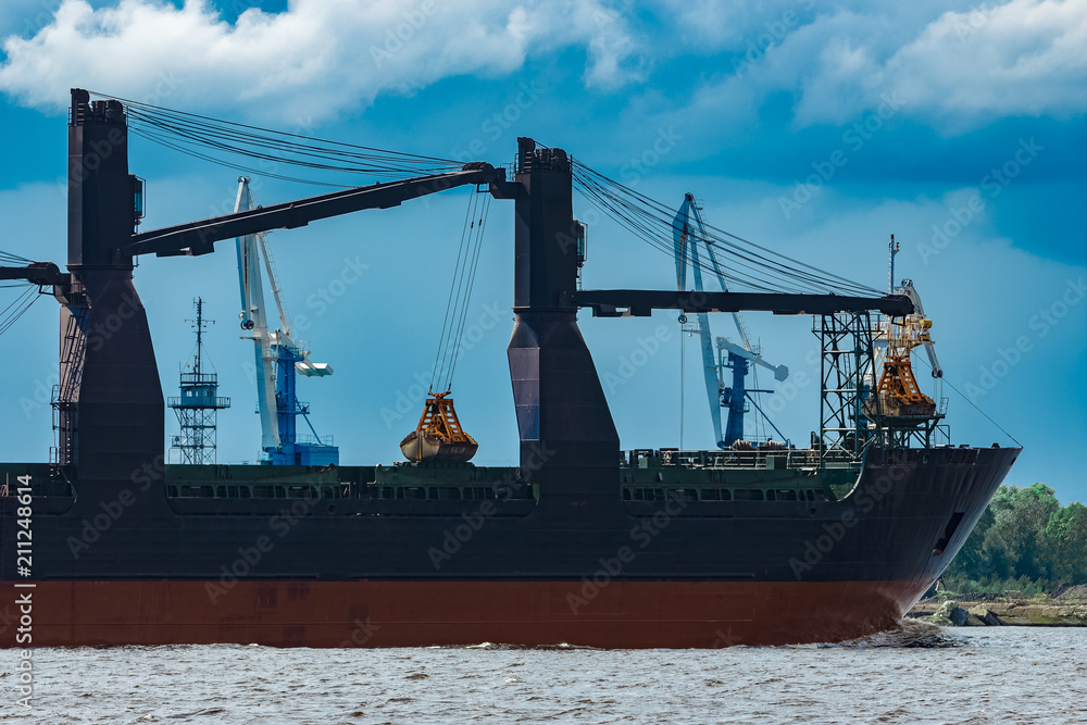 Fototapeta premium Blue cargo ship underway