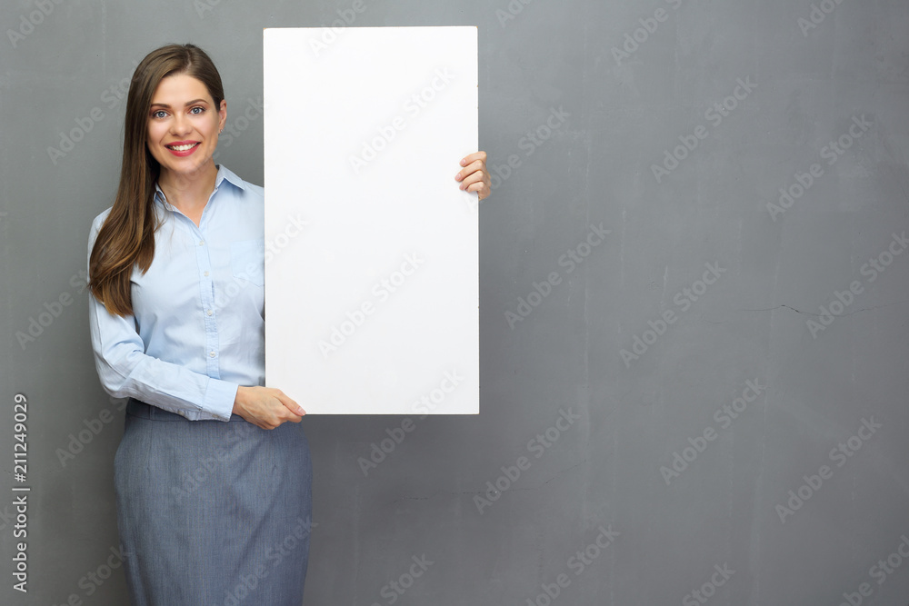 Smiling woman holding white board for advertising signs. Smiling woman holding white board for advertising signs.