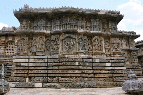 Ornate bas relieif and sculptures of Hindu deities, North wall, Kedareshwara Temple, Halebid, Karnataka photo