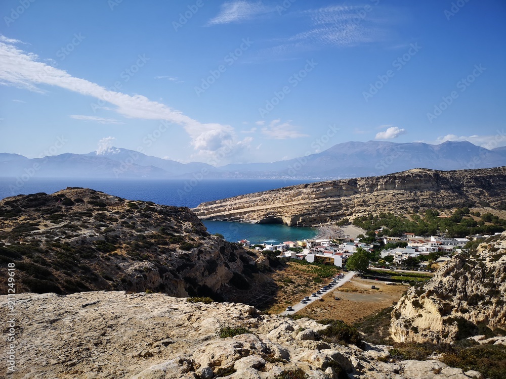 Matala beach panorama covered by mountains