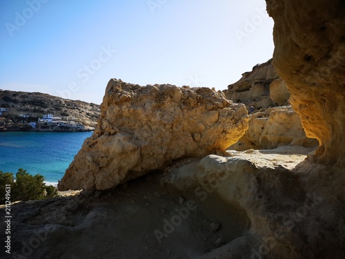 Beautiful rock formation with a blue beach in the background