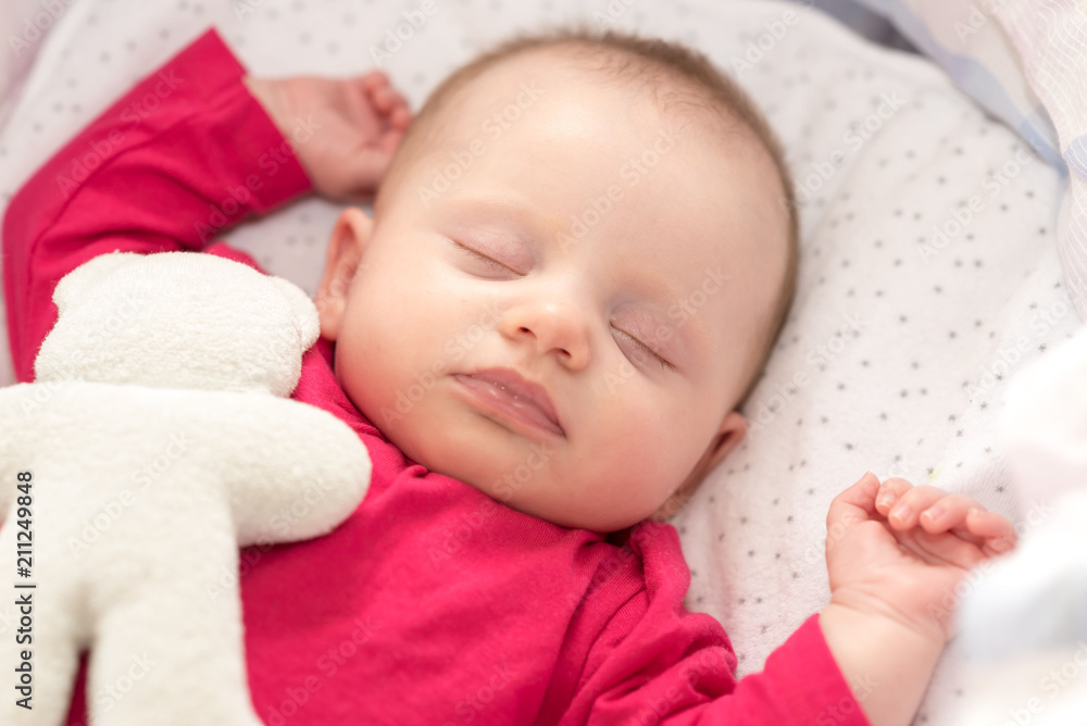 Portrait of baby sleeping in a crib