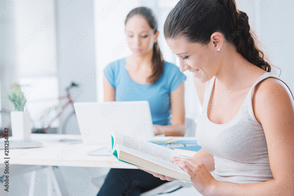 Teen girls studying at home Teen girls studying at home