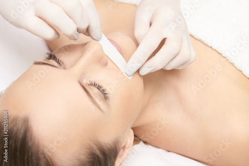 Sugar hair removal from woman body. Wax epilation spa procedure. Procedure beautician female. Mustache