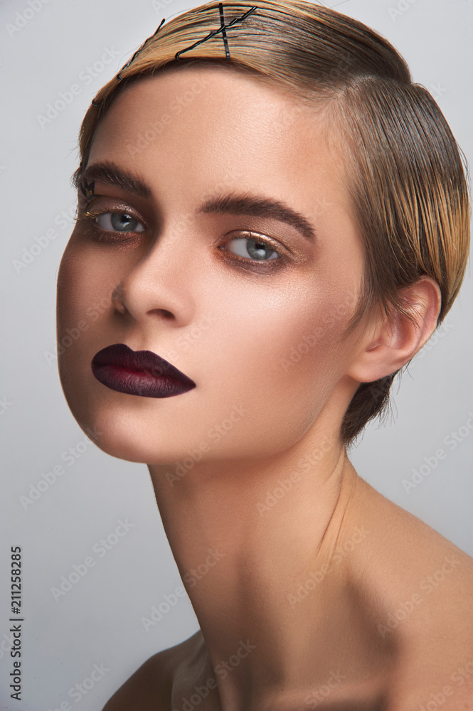 Beauty portrait of a young girl who is made in a photo Studio