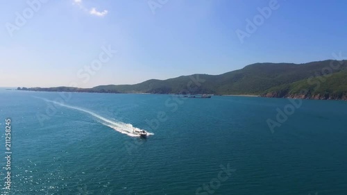 a large boat sails along the bay