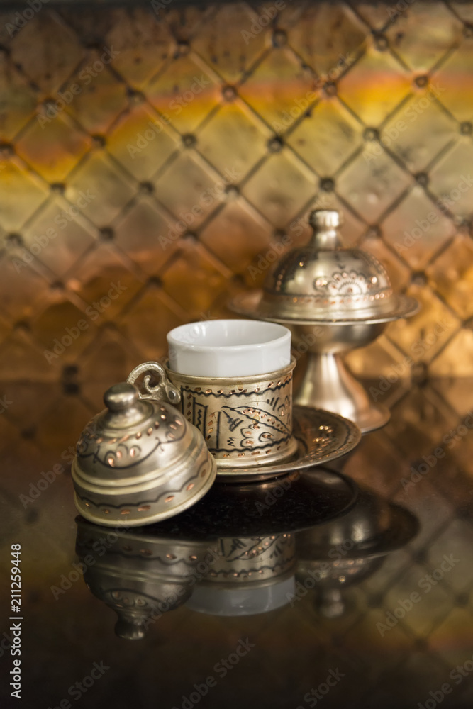 copper kitchenware on the black background with reflection. copper kitchenware on the black background with reflection.