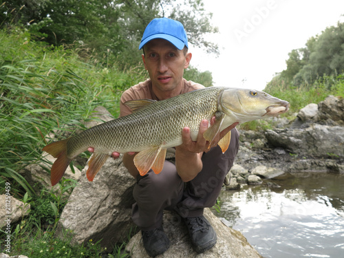 Fototapeta Naklejka Na Ścianę i Meble -  Coarse fishing for barbel in river