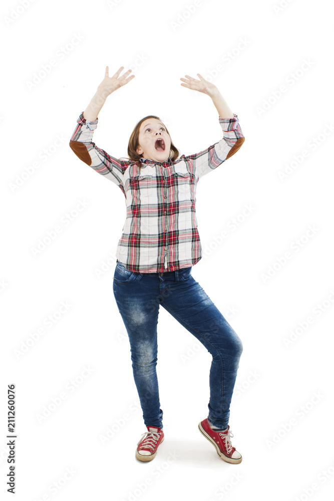 Surprised girl looking up with her hands up. Isolated on white background Surprised girl looking up with her hands up. Isolated on white background