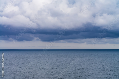 Fototapeta Naklejka Na Ścianę i Meble -  dense rain clouds over the sea