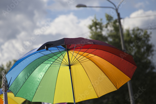 Gay pride participant with rainbow colored umbrella © sandor69kv