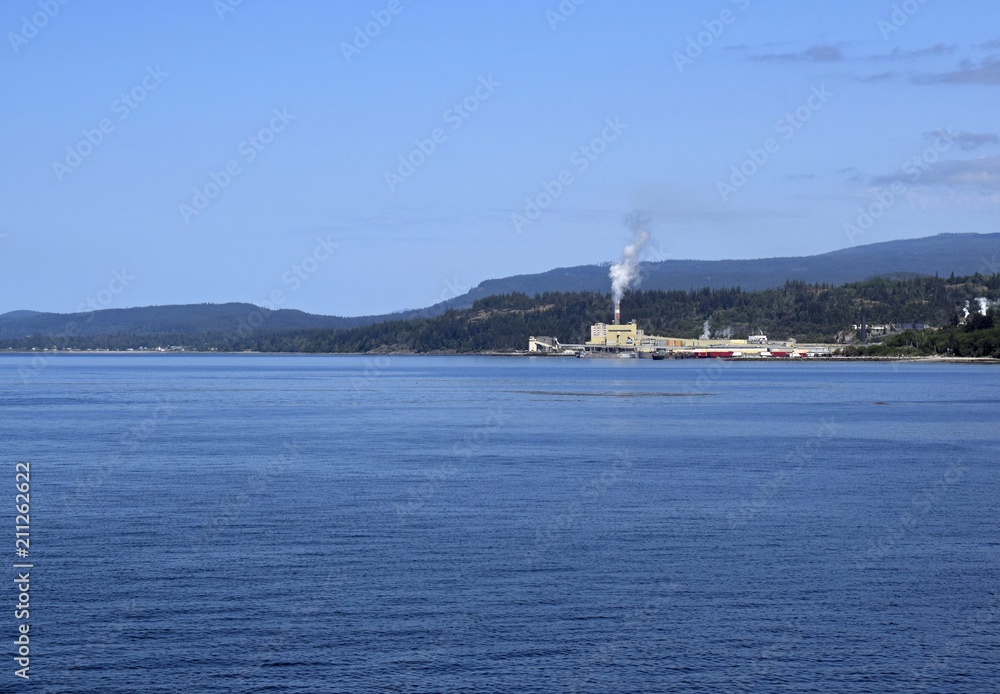 Powell River pulp mill and coastline seen from the ocean, British Columbia Canada