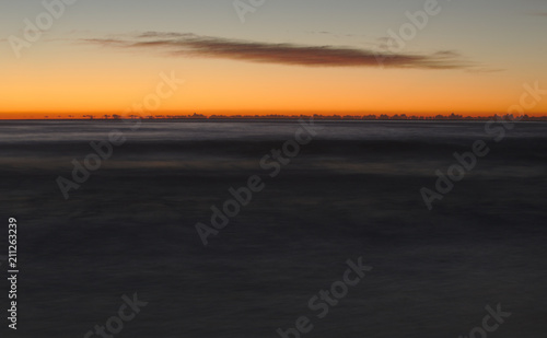Ocean scene during Sunrise © James