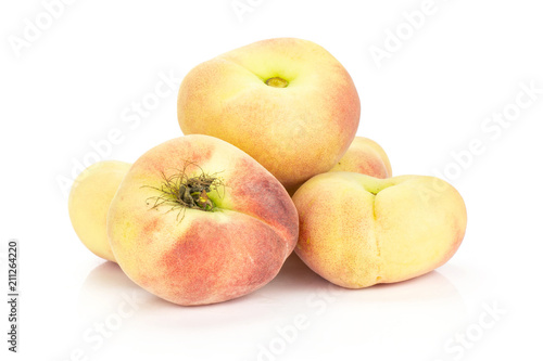 Fresh Saturn peaches isolated on white background.