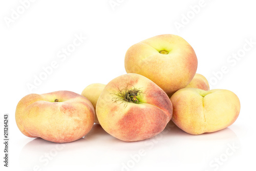Ripe Saturn peaches isolated on white background.