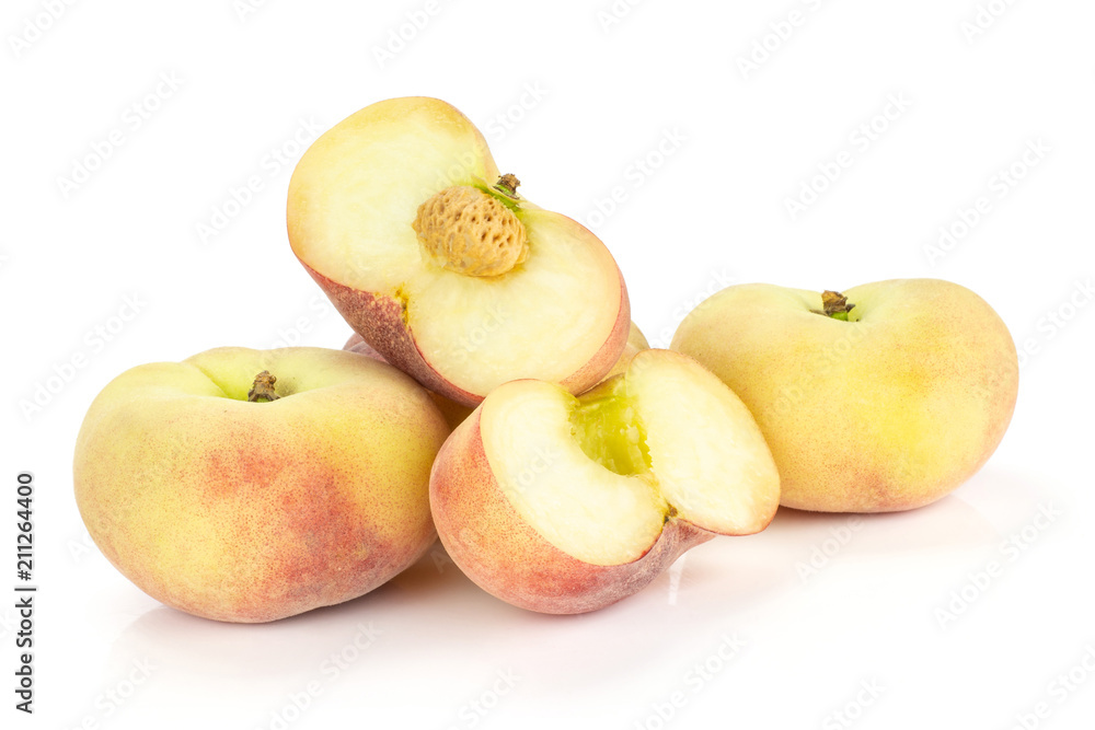 Fresh ripe Saturn peaches and two sliced halves isolated on white background. Fresh ripe Saturn peaches and two sliced halves isolated on white background.