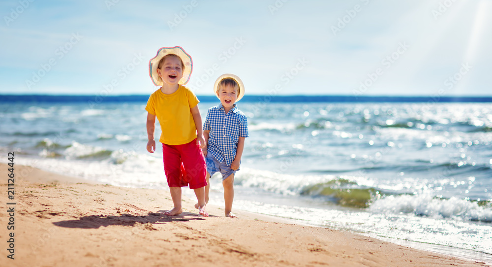 Boy and girl playing on the beach