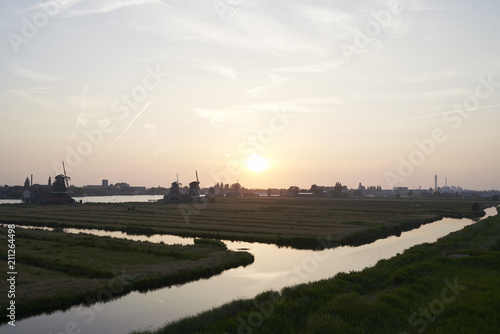 Sunset at the Zaanse Schans, an area just outside of Amsterdam with a lot of traditional wind mills. photo