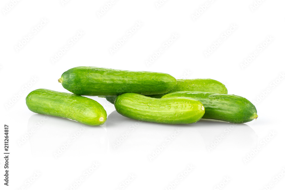 Five fresh green mini cucumbers isolated on white background. Five fresh green mini cucumbers isolated on white background.