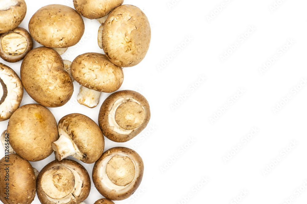 Fototapeta premium Fresh raw brown champignons top view isolated on white background.