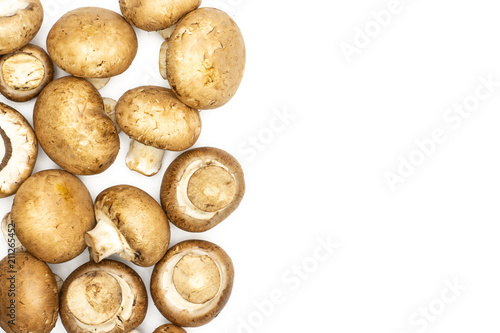 Fresh raw brown champignons top view isolated on white background.