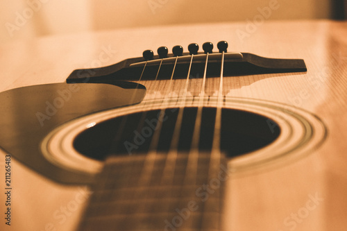 The image of an acoustic guitar, a musical instrument.