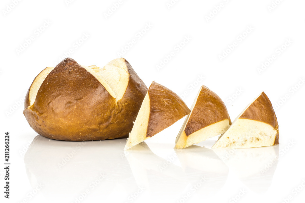One Bavarian bread bun and three slices in row isolated on white background fresh baked loaves. One Bavarian bread bun and three slices in row isolated on white background fresh baked loaves.