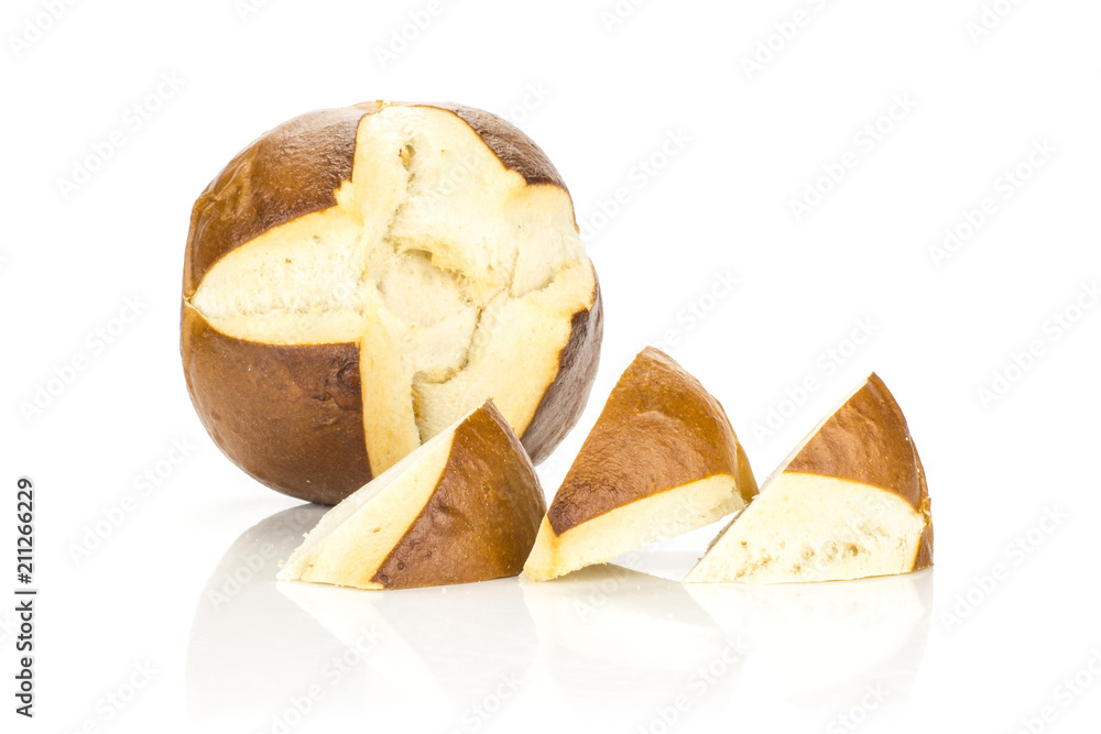 One Bavarian bread bun and three slices isolated on white background fresh baked loaves. One Bavarian bread bun and three slices isolated on white background fresh baked loaves.