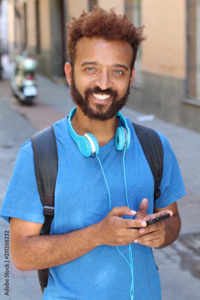 © ajr_images - Millennial holding phone on the street © ajr_images - Millennial holding phone on the street