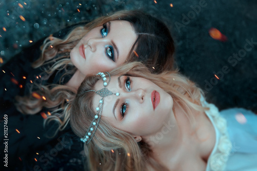 Fényképezés Two girls of the elements, opposites, love each other with affection