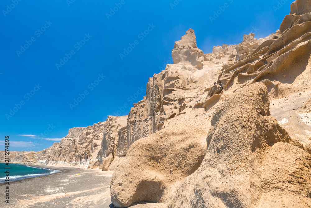Fototapeta premium Beautiful beach with volcanic mountains. Vlychada beach, Santorini island, Greece