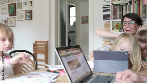 family  with  three  children  indoor  using  tablet  -  togetherness,  technology,  entertainment  concept 