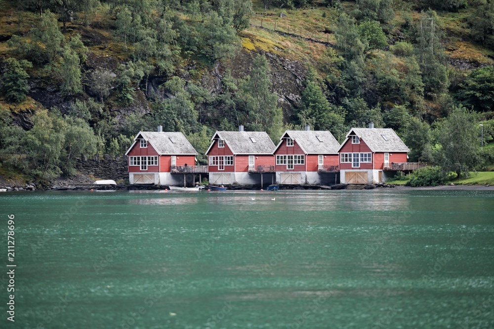 Typical red wooden houses in a norwegian fjord Typical red wooden houses in a norwegian fjord