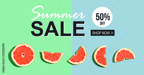 Summer sale message with halved fresh grapefruits