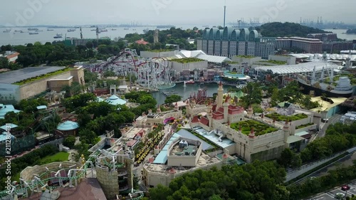 Drone shot of roller coaster and other attractions in Sentosa island theme park in Singapore