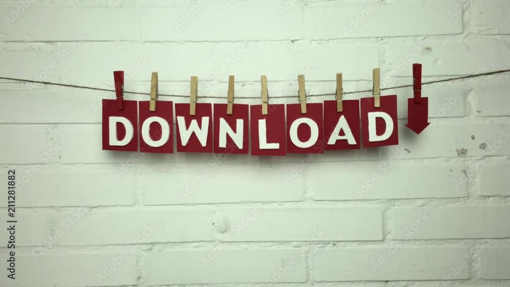 Palabra “download” en una cuerda con pinzas sobre fondo de ladrillos.