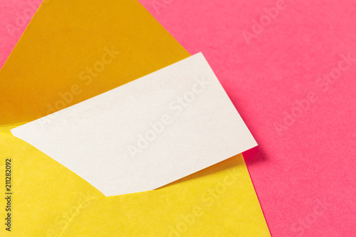 Paper envelopes on a colored pink background
