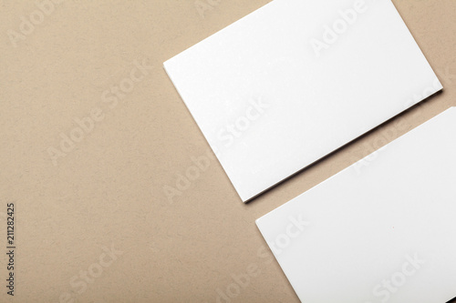 Blank paper pieces for mock up on a beige background © fotofabrika
