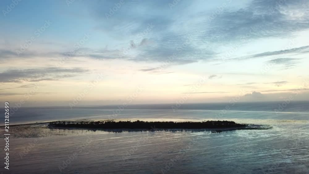 Aerial of Tranquil Tropical Island at Sunset in Wakatobi National Park Aerial of Tranquil Tropical Island at Sunset in Wakatobi National Park
