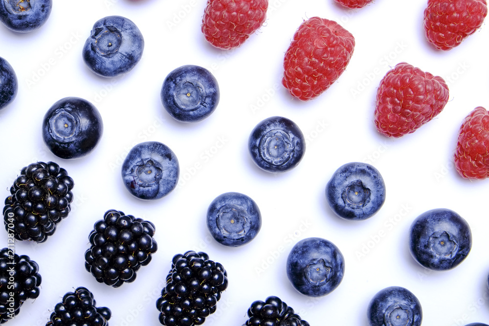 Fresh organic mixed berries: blueberry, raspberry & blackberry in seamless pattern, white background. Clean eating concept. Healthy vegan snack, raw food diet. Close up, copy space, top view, flat lay Fresh organic mixed berries: blueberry, raspberry & blackberry in seamless pattern, white background. Clean eating concept. Healthy vegan snack, raw food diet. Close up, copy space, top view, flat lay