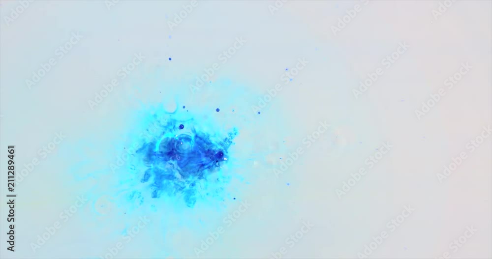 Blue ink drop slashing in water. On white background Blue ink drop slashing in water. On white background