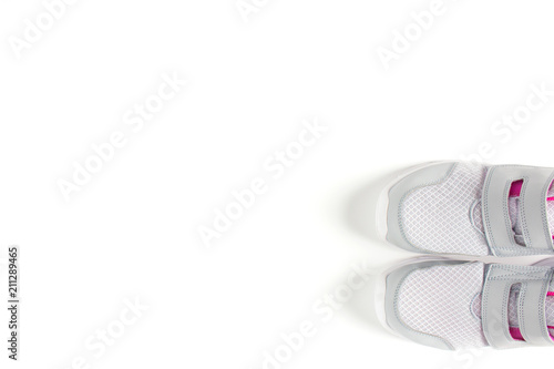 Two gray sneakers on isolated (white) background