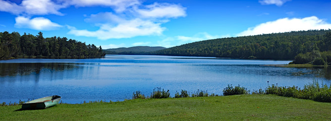 A summer camp setting on an alpine lake in Northern Michigan.