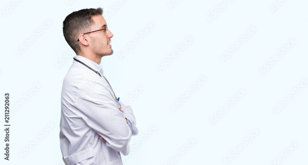 Handsome young doctor man looking to side, relax profile pose with natural face with confident smile. Handsome young doctor man looking to side, relax profile pose with natural face with confident smile.
